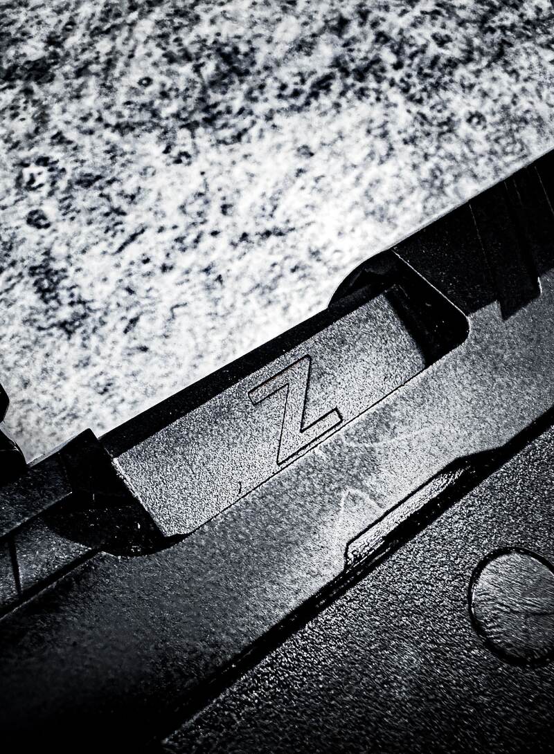 Macro detail of a KWA slide in matte black